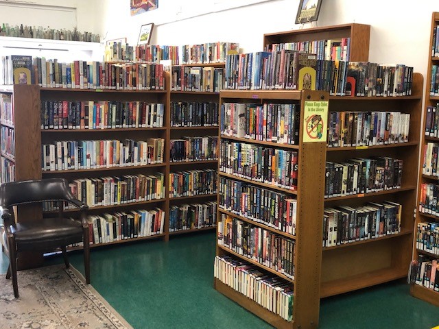An image of a library with many books.
